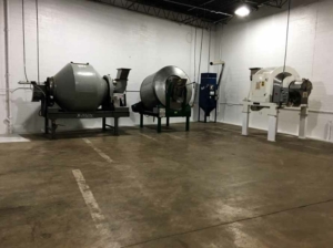 Industrial tea processing and packaging equipment inside Custom Co-Pak's facility in the USA